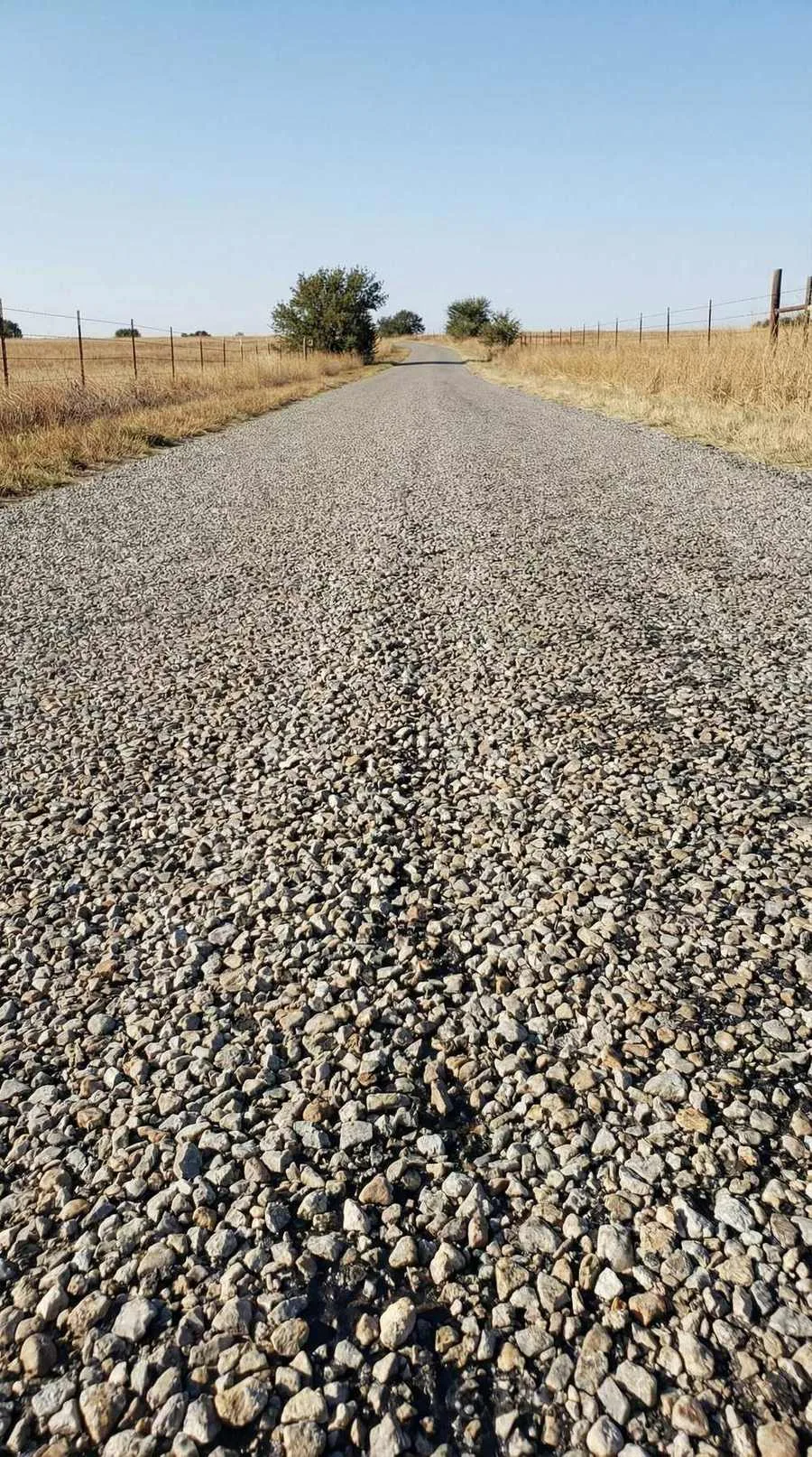 Chip seal driveway running through Montana rangeland