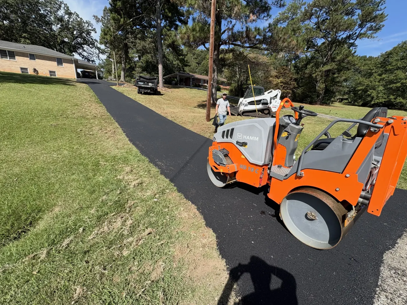 HAMM roller compacting a fresh asphalt driveway