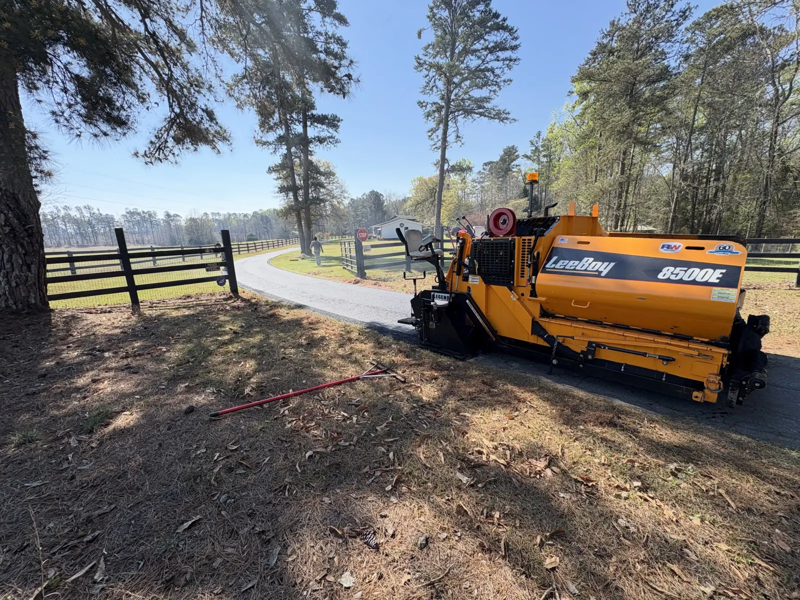 Paver laying fresh asphalt on a Montana driveway